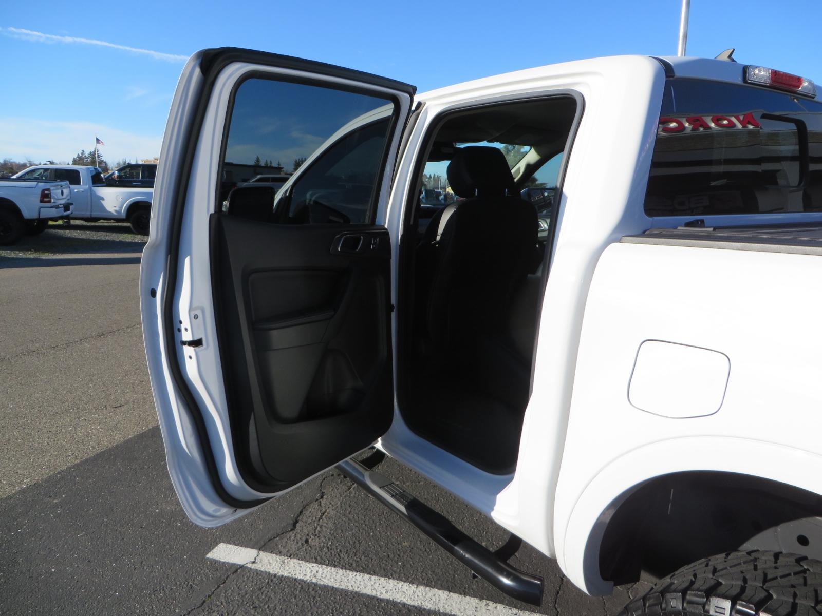 2019 White /Black Ford Ranger Lariat (1FTER4FHXKL) with an 2.3L engine, automatic transmission, located at 2630 Grass Valley Highway, Auburn, CA, 95603, (530) 508-5100, 38.937893, -121.095482 - Features a Fabtech suspension system, Fuel Offroad wheels, Nitto Ridge Grappler tires, Westin Running boards, and a Bakflip. - Photo #30